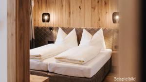 Postel nebo postele na pokoji v ubytování Hotel Thurnerhof