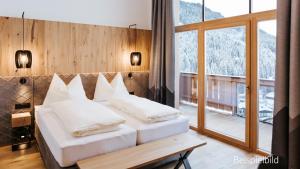Posteľ alebo postele v izbe v ubytovaní Hotel Thurnerhof