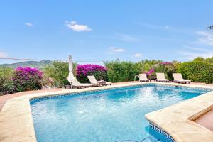 a swimming pool with lounge chairs at Villa up to 8 sleeps 4 bedrms 2 in Jávea