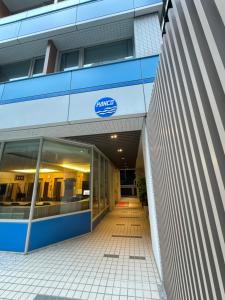 an entrance to a building with the samsung logo on it at 盤古捷旅 - Panco Hotel in Taipei