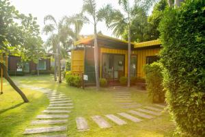 a house with a pathway in front of it at Beach Box at Pran in Sam Roi Yot