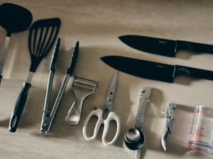 a group of kitchen utensils sitting on top of a table at illi Com Shimokitazawa in Tokyo