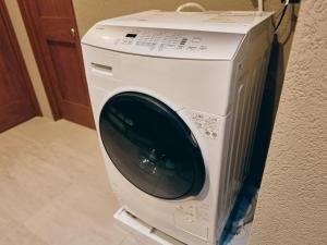 a washing machine is sitting on a shelf at illi Com Shimokitazawa in Tokyo