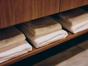 a bunch of towels are sitting on a shelf at illi Com Shimokitazawa in Tokyo