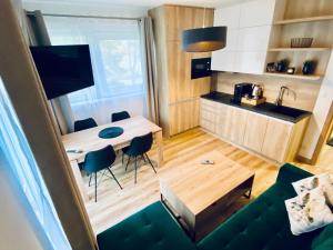 TV a/nebo společenská místnost v ubytování Apartmán Na Břehu Lipna