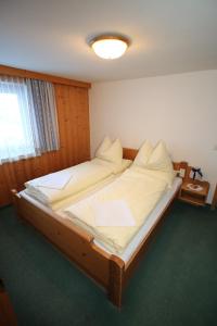 Rúm í herbergi á Liftgasthof Appartements