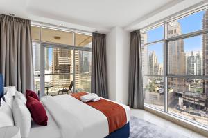 Postel nebo postele na pokoji v ubytování StoneTree - Fully Furnished 1BR in Dubai Marina + 15 fotografií