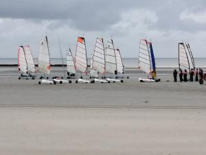 a group of sail boats on the beach at Le Cocon des Dunes in Quend