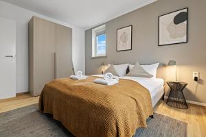 Postel nebo postele na pokoji v ubytování ma suite - Augsburg Hochzoll City