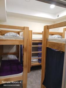 two sets of bunk beds in a room at Metro Hostel in Yerevan