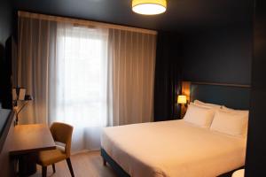 Hôtel de la Cité客房内的一张或多张床位