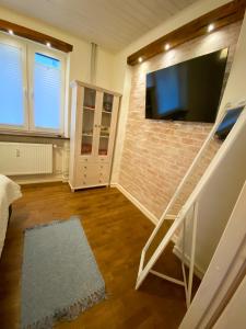 TV a/nebo společenská místnost v ubytování Central Serenity Suite