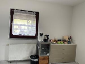 Příslušenství pro přípravu čaje a kávy v ubytování Vida Real Estate Feucht