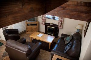a living room with a couch and a table at RB Contractor Stays - Celyn in Pwllheli