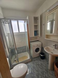 a bathroom with a shower and a toilet and a sink at 1BDR Apartment-Aglantzia in Aglantzia