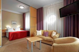 מיטה או מיטות בחדר ב-Rixwell Viru Square Hotel