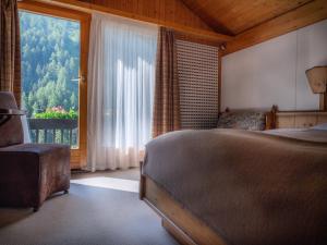 Postelja oz. postelje v sobi nastanitve Hôtel Cristal - Swiss Riders Lodge Grimentz
