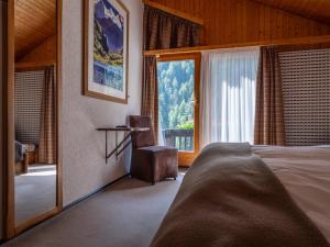 Postelja oz. postelje v sobi nastanitve Hôtel Cristal - Swiss Riders Lodge Grimentz