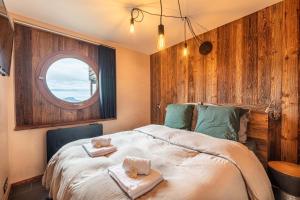 En eller flere senge i et værelse på L Aster - IMMODREAMS - Avoriaz