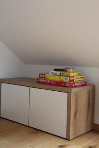 a pile of books sitting on top of a table at Apartment Simona in Kranjska Gora