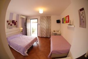 a small room with a bed and a window at B&B Le Colline Country House in Anguillara Sabazia