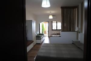 A bed or beds in a room at B&B Le Colline Country House