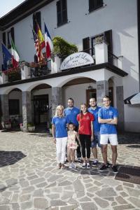 a group of people standing in front of a building at Hotel Paradiso Como in Brunate