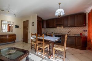 Kuchyňa alebo kuchynka v ubytovaní Inn Aosta Apartments