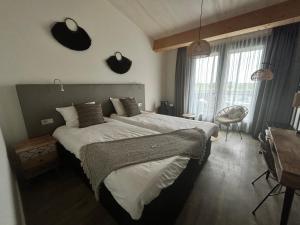 Postel nebo postele na pokoji v ubytování Fruitpark Hotel & Spa