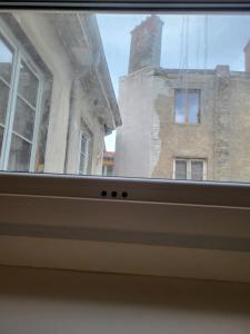 a view of a building from a window at Ainay/centre Lyon/un cocon ! in Lyon