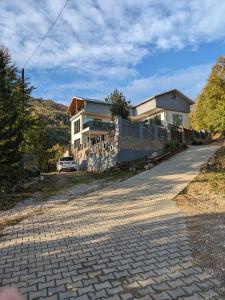 a house with a car parked in front of it at Turkish Mountain Retreat in Saadet