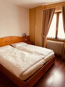 Postel nebo postele na pokoji v ubytování Garnì Bonsai