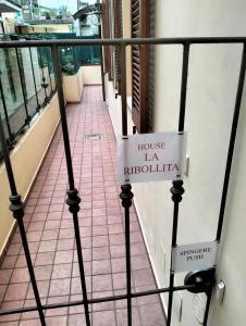 a balcony with a sign that reads house la ritzilia at Appartamento LA RIBOLLITA in Pesaro