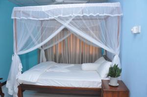 Ein Bett oder Betten in einem Zimmer der Unterkunft Sasiri lanka Room and Apartment