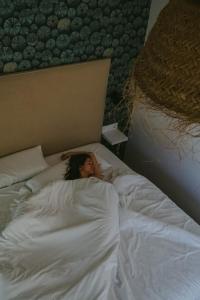 A bed or beds in a room at Cabanas de Udra