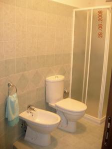 a bathroom with a toilet and a sink at B&B La Porta Dell'Etna - Nicolosi in Nicolosi