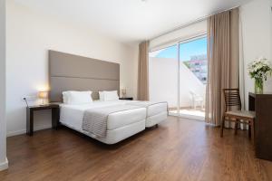 Cama o camas de una habitación en Clube Vilarosa