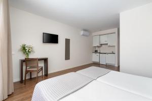 Cama o camas de una habitación en Clube Vilarosa