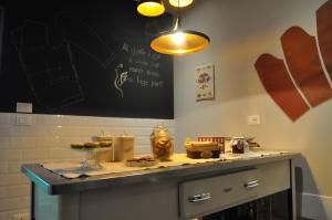 a kitchen with a counter with food on it at Le Sartorie in Pozzuolo del Friuli +14 photos