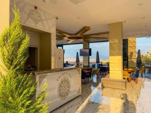 a resort with a dining area with a view at Castle Light Boutique in Alanya