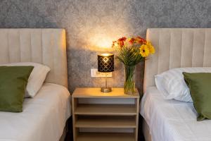 Postel nebo postele na pokoji v ubytování Hotel Dolenjc