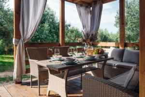 a patio with a table and chairs and a couch at House no 2 in Pakoštane