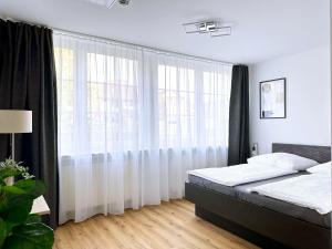 Postel nebo postele na pokoji v ubytování Schöne Apartments I private Parkplätze I home2share