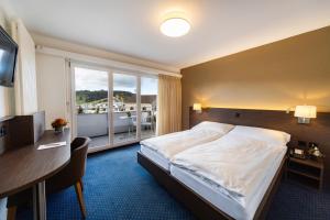 Postel nebo postele na pokoji v ubytování Hotel Drei Könige + 37 fotografií