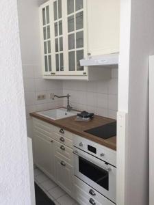 Kjøkken eller kjøkkenkrok på Perfektes Appartement am Düsseldorfer Rhein