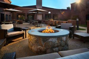 a fire pit in the middle of a patio at Courtyard by Marriott Boston Norwood/Canton in Norwood
