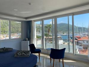 a bedroom with a bed and a view of a harbor at Mert Homes Marmaris in Marmaris