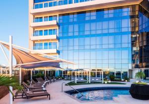a hotel with a swimming pool and a building at Hyatt Regency San Luis Potosi in San Luis Potosí