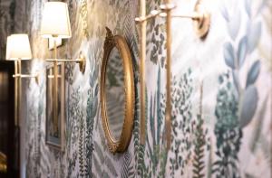 a mirror on a wall in a room at The White Hart Hotel Lincoln in Lincoln