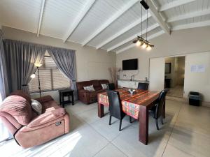 a living room with a table and a couch at Nomland in Walvis Bay